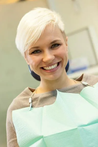 patient smiling after getting dental bonding