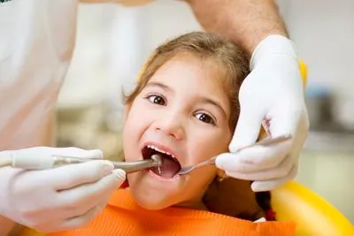 young patient getting a dental checkup at Derek H. Tang, DDS