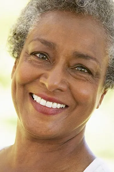 woman smiling after dental bonding helped restore her smile